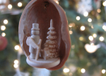 Little tree-lover carved into a walnut shell.